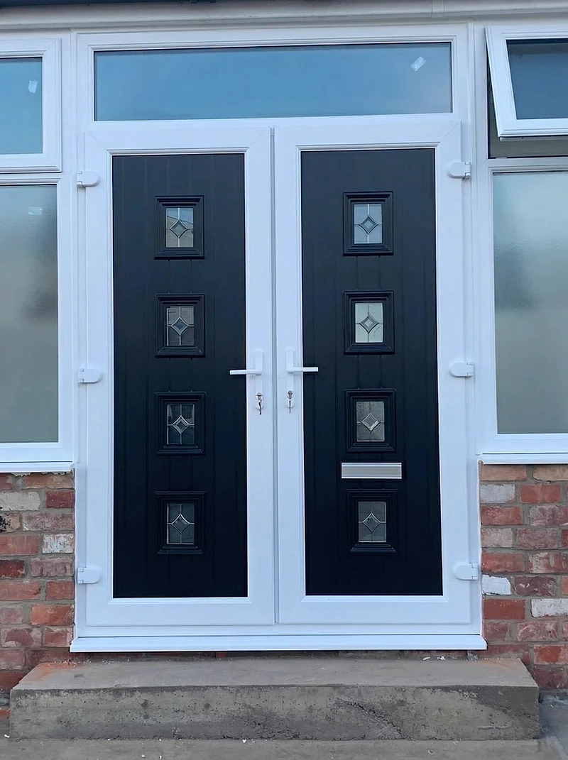 Black double composite doors with decorative glass panels — Stylo Glazing installation