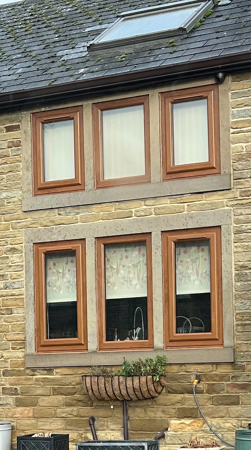 Golden oak effect uPVC windows on Yorkshire stone cottage